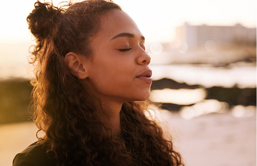 woman taking a deep breath