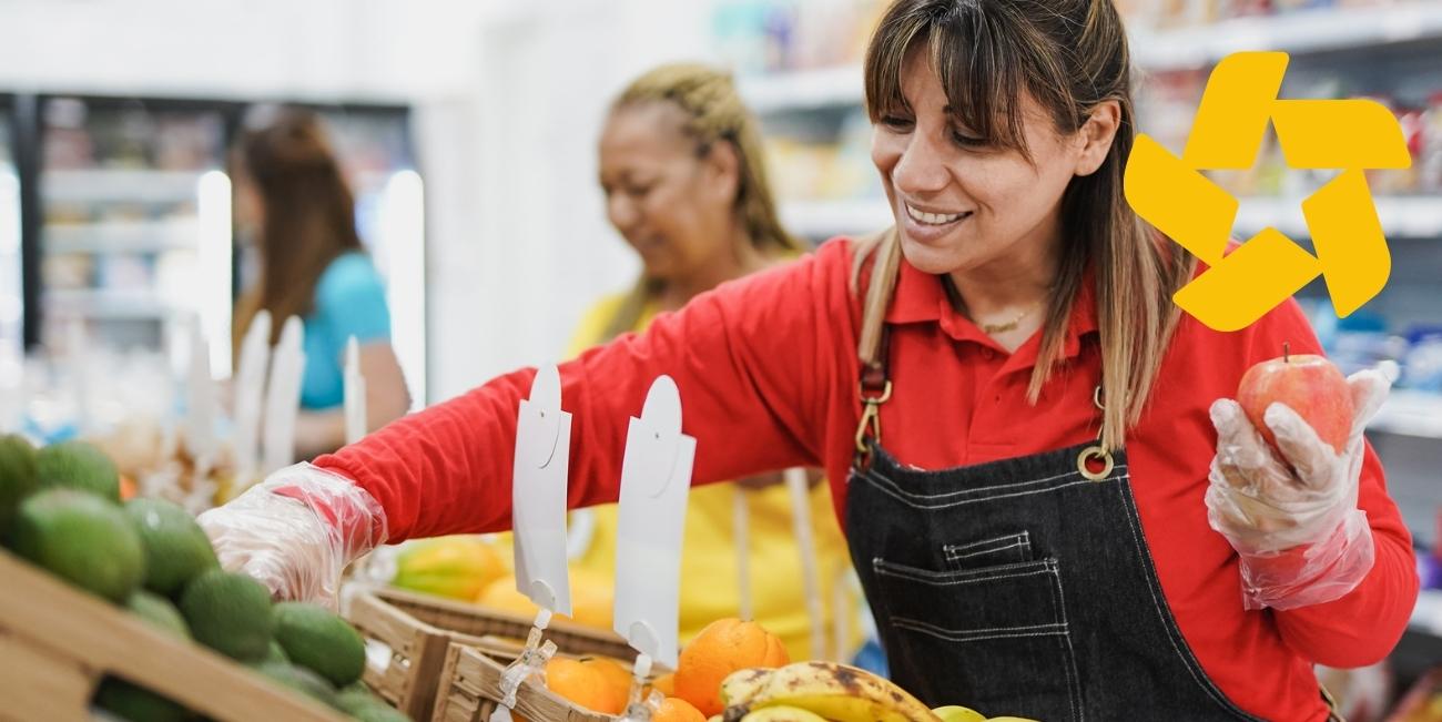 woman working in grocery aisle with yellow icon in top right corner